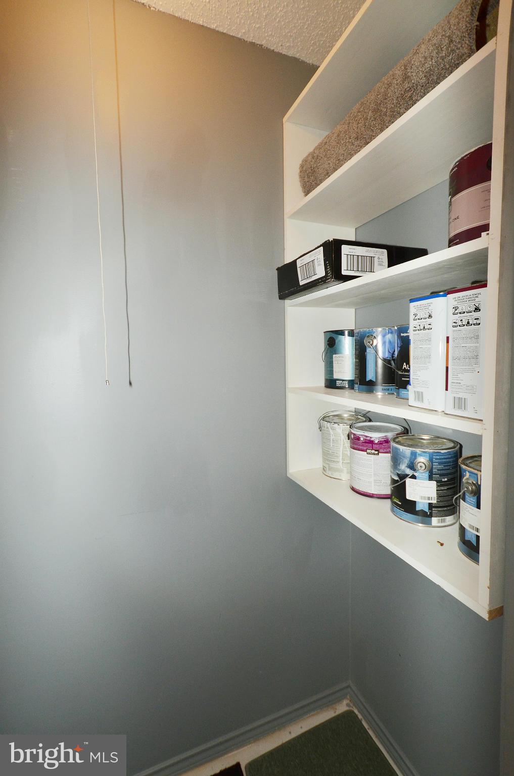 21019 Timber Ridge Terrace, Unit 302 Ashburn, VA 20147 - Photo 25 of 27 a view of storage and utility room with empty racks