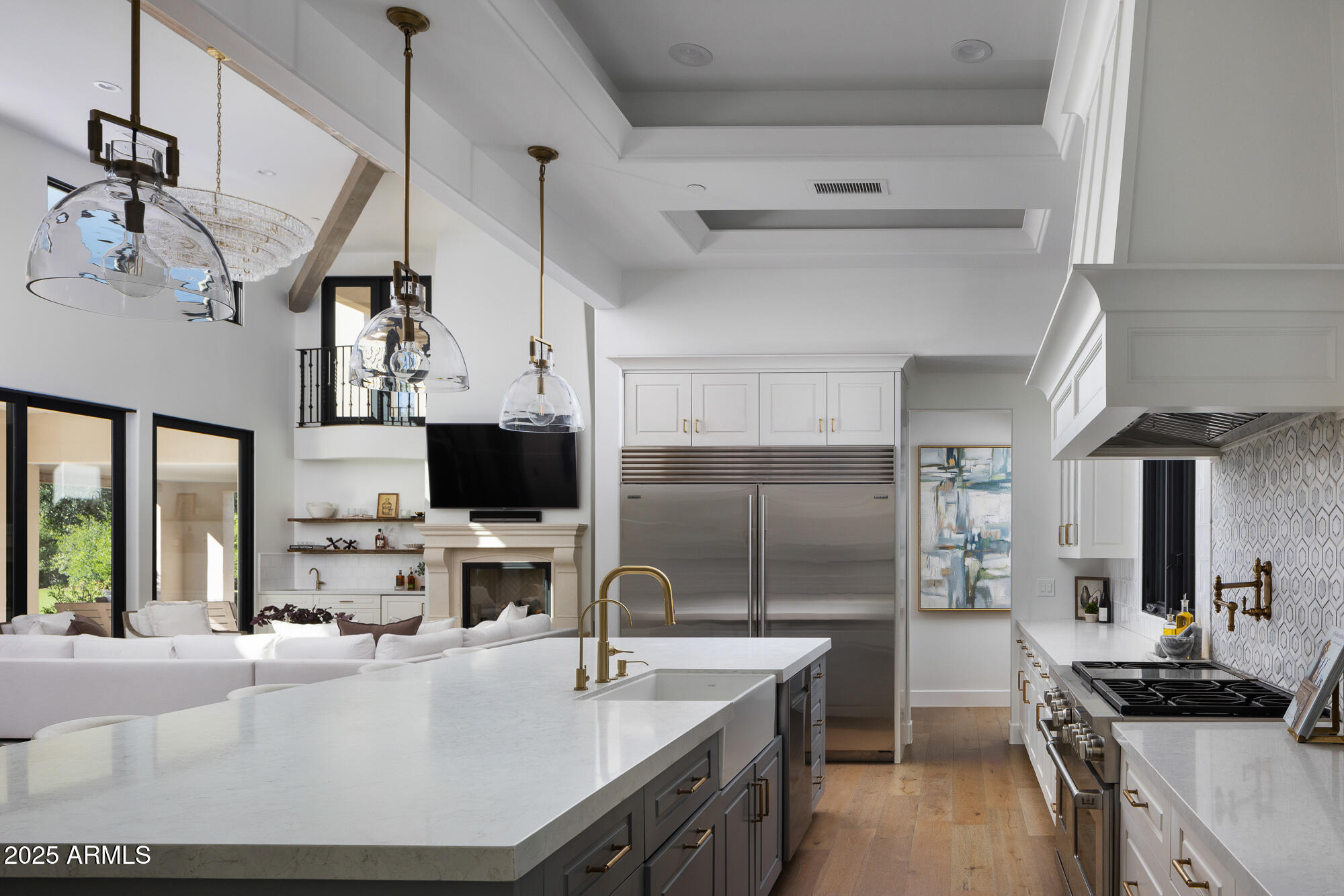 7730 North Mockingbird Lane Paradise Valley, AZ 85253 - Photo 13 of 42 a kitchen with kitchen island a sink stove and refrigerator