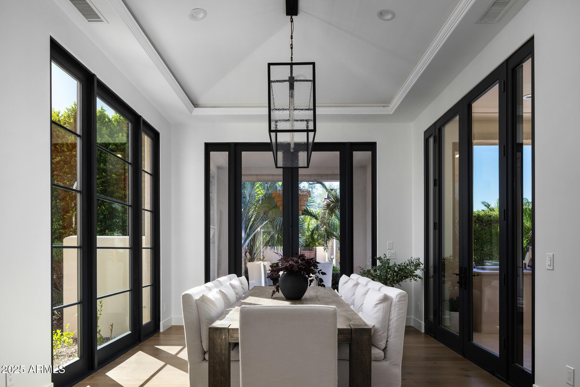 7730 North Mockingbird Lane Paradise Valley, AZ 85253 - Photo 14 of 42 a room with furniture a chandelier and a chandelier