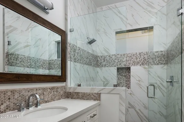 a bathroom with a sink and a mirror
