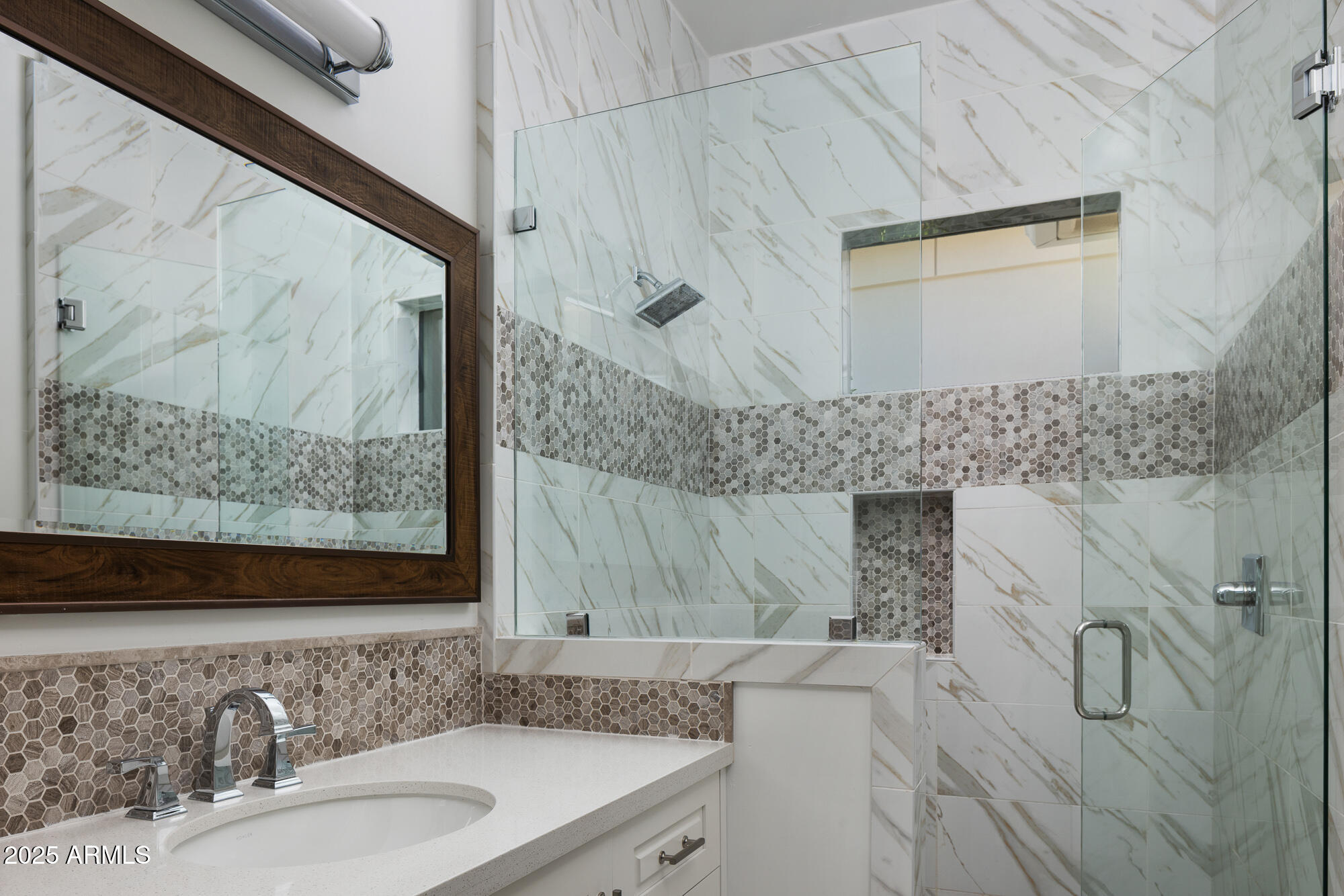 7730 North Mockingbird Lane Paradise Valley, AZ 85253 - Photo 23 of 42 a bathroom with a sink and a mirror