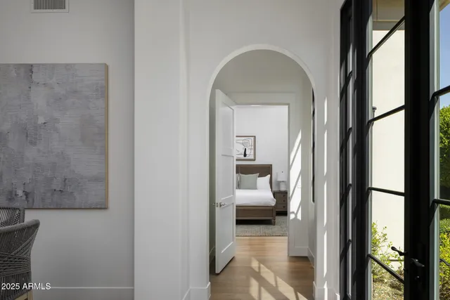 a view of a bedroom from a corridor