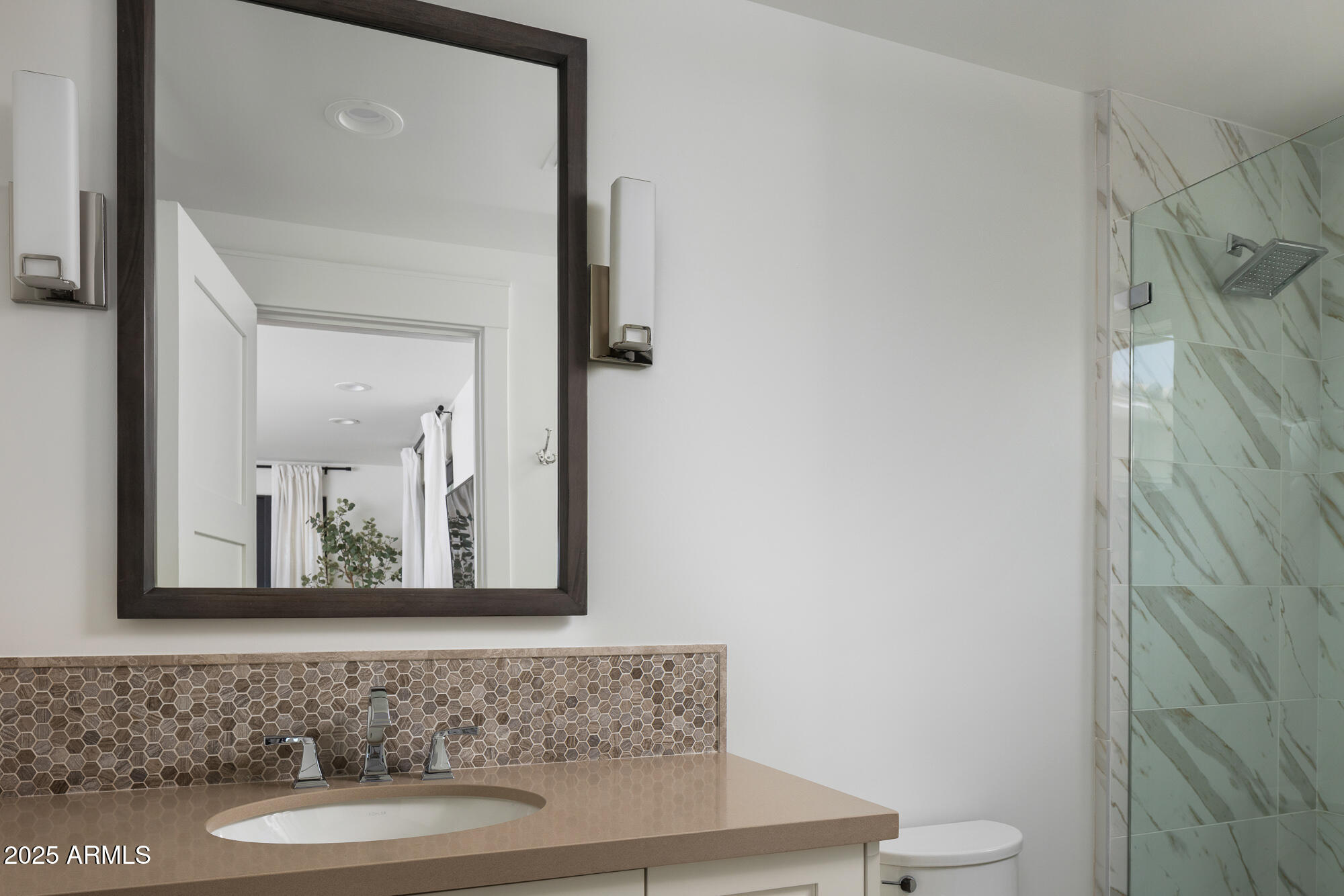 7730 North Mockingbird Lane Paradise Valley, AZ 85253 - Photo 28 of 42 a bathroom with a sink and a mirror