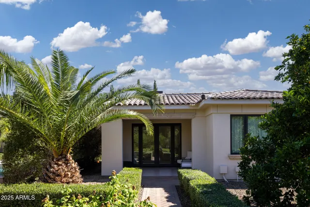 a front view of a house with lots of green space