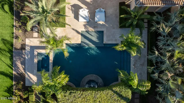 a view of a kitchen with a sink and chandelier
