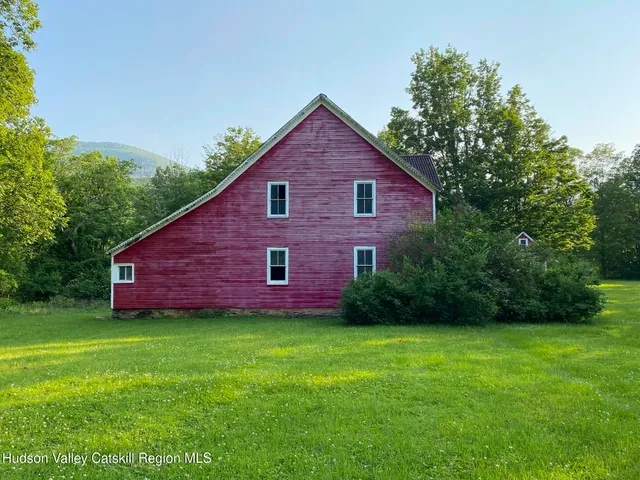 a aerial view of a house with a yard and a garden