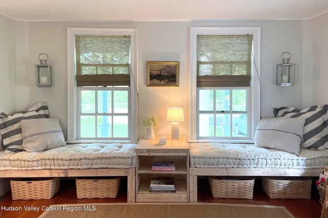 a bedroom with a bed and a book shelf