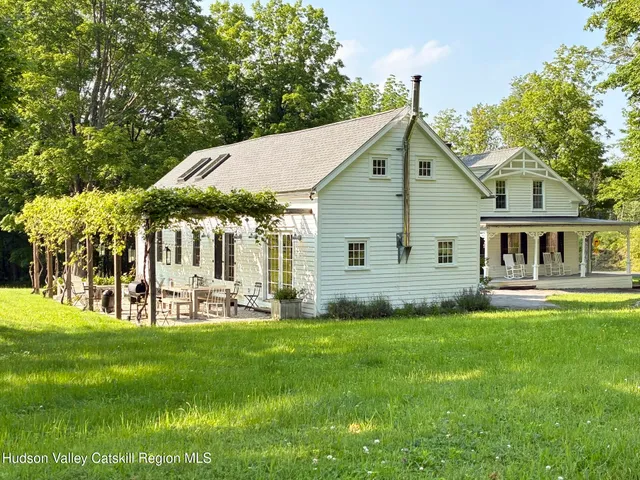 a view of house with backyard