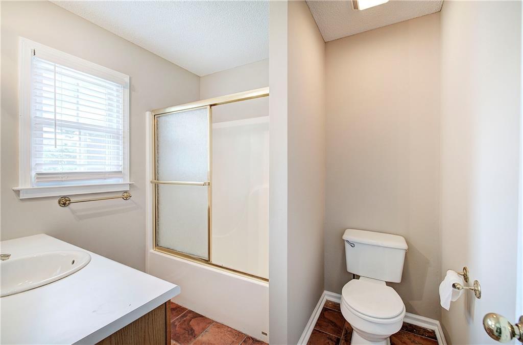 218 Gilreath Road Southeast Cartersville, GA 30121 - Photo 16 of 27 a bathroom with a toilet a sink and a window