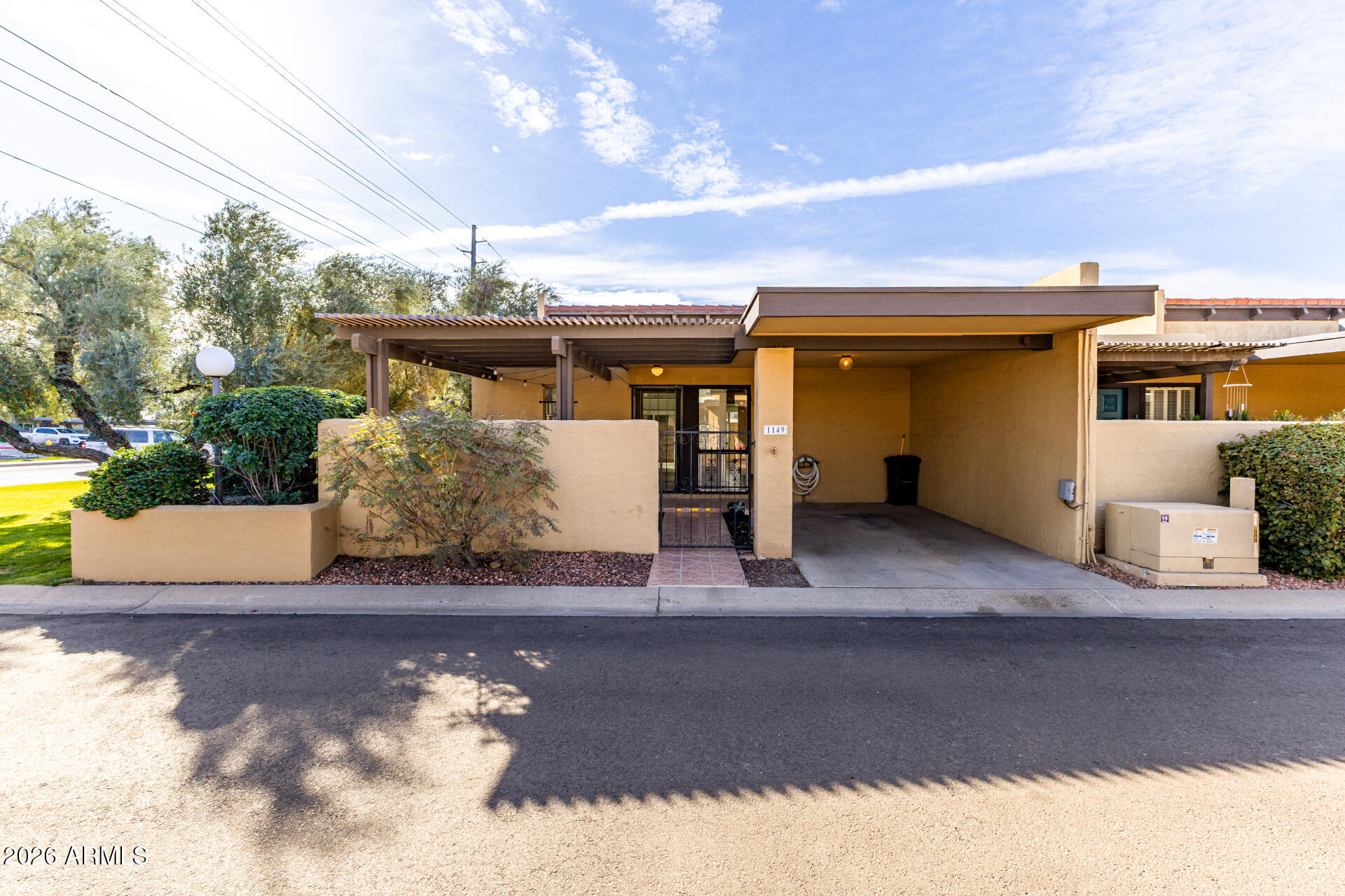 1149 East Rovey Avenue Phoenix, AZ 85014 - Photo 1 of 25 a view of a house with a yard