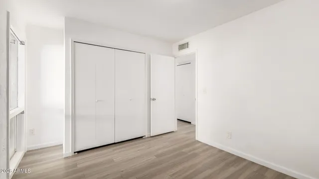 a bathroom with a sink a toilet a mirror and shower