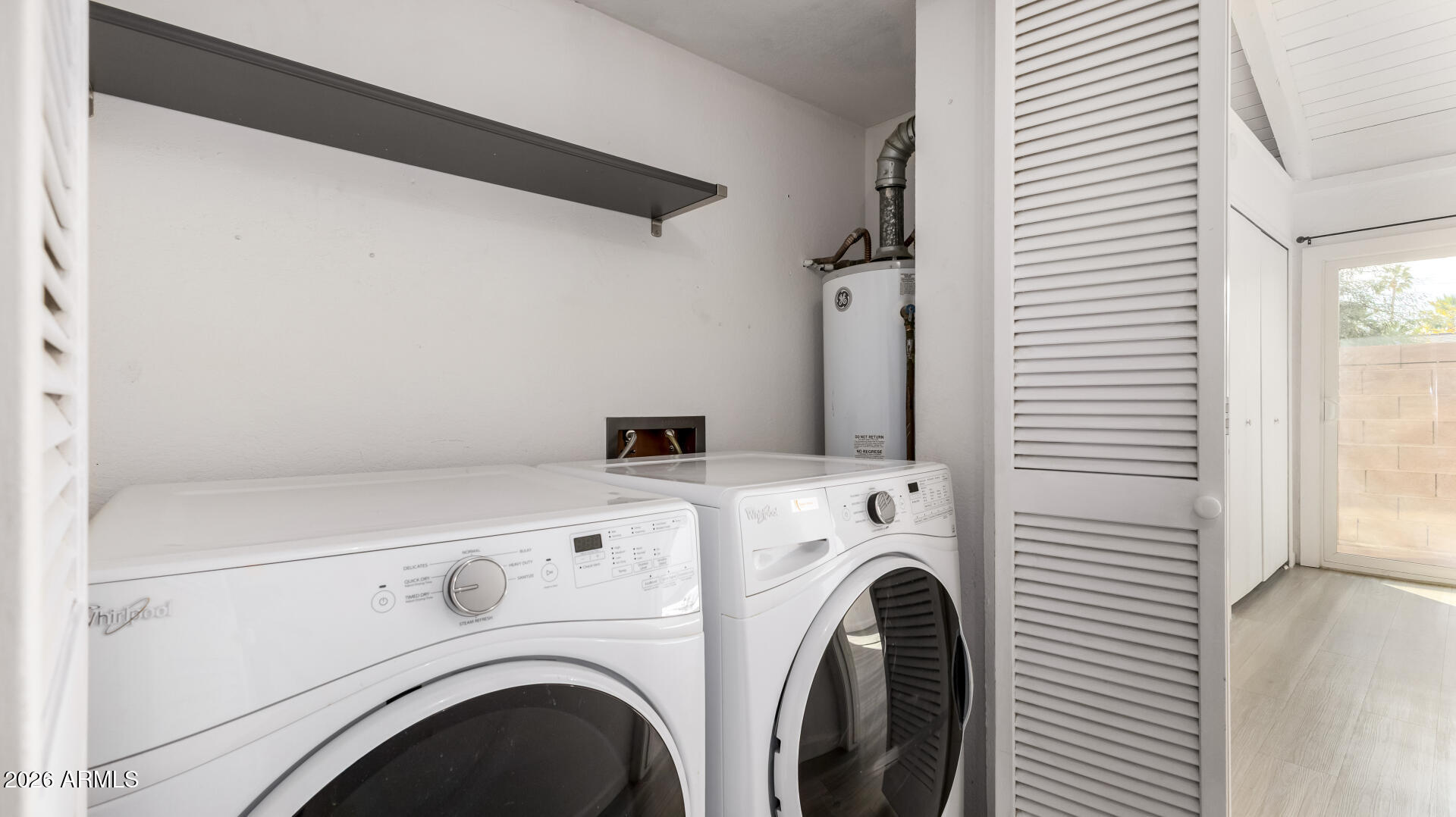 1149 East Rovey Avenue Phoenix, AZ 85014 - Photo 20 of 25 a utility room with dryer and washer