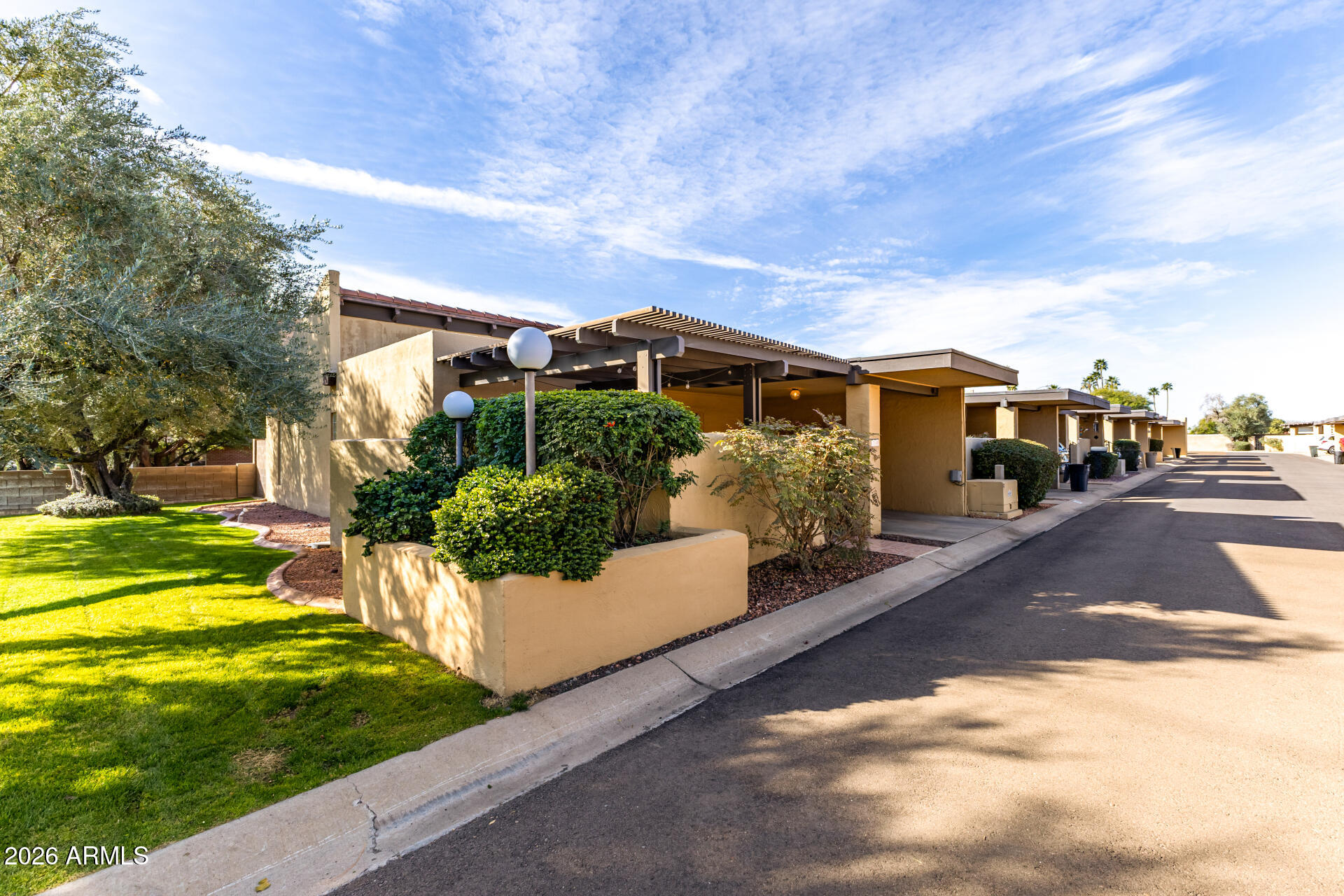 1149 East Rovey Avenue Phoenix, AZ 85014 - Photo 2 of 25 a front view of a house with a yard