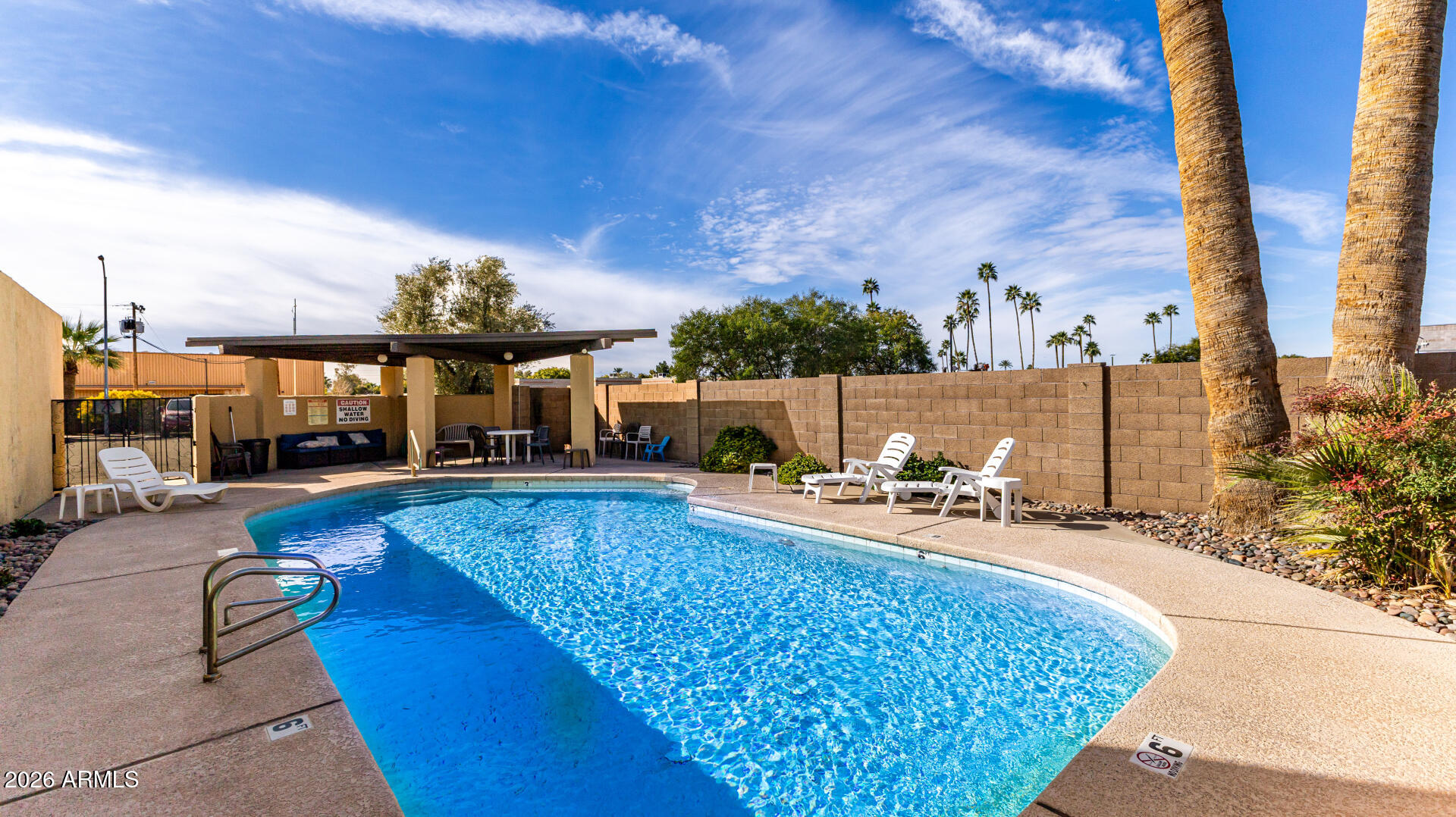 1149 East Rovey Avenue Phoenix, AZ 85014 - Photo 23 of 25 a view of a swimming pool with sitting area