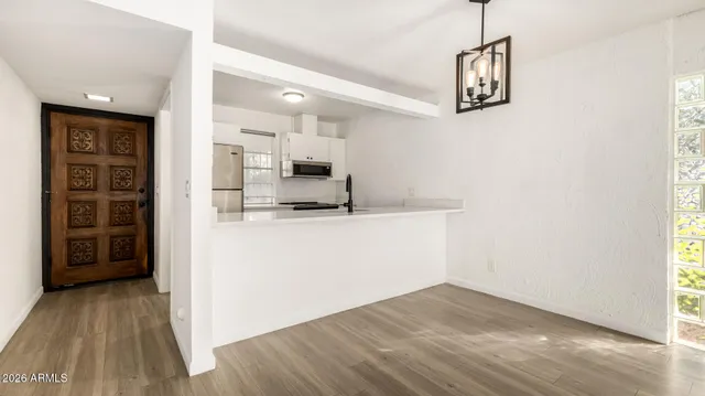 a kitchen with stainless steel appliances a refrigerator and a stove