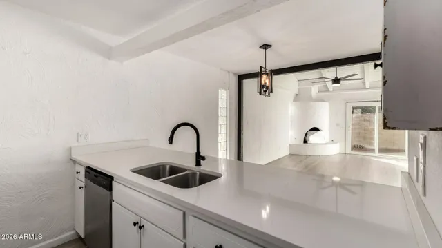 a view of an empty room and fire place