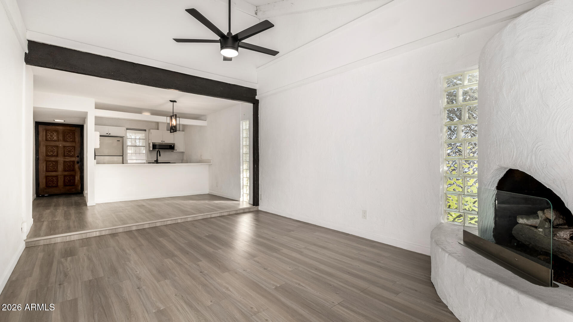 1149 East Rovey Avenue Phoenix, AZ 85014 - Photo 10 of 25 a view of an empty room and fire place