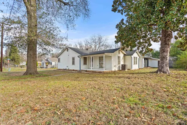 a house with trees in front of it