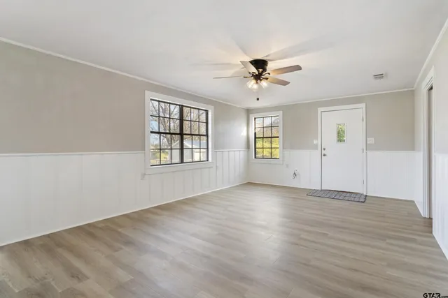 a view of an empty room with a window