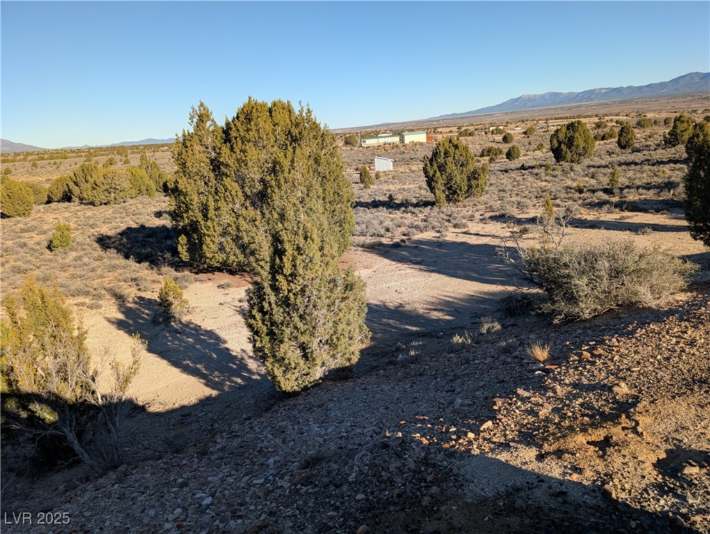 Angela Court Pioche, NV 89043 - Photo 7 of 10 View of mountain backdrop featuring a desert landscape and rural landscape