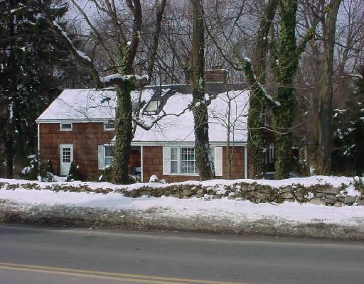 217 Hollow Tree Ridge Road Darien, CT 06820 - Photo 1 of 1 a front view of a house with a yard