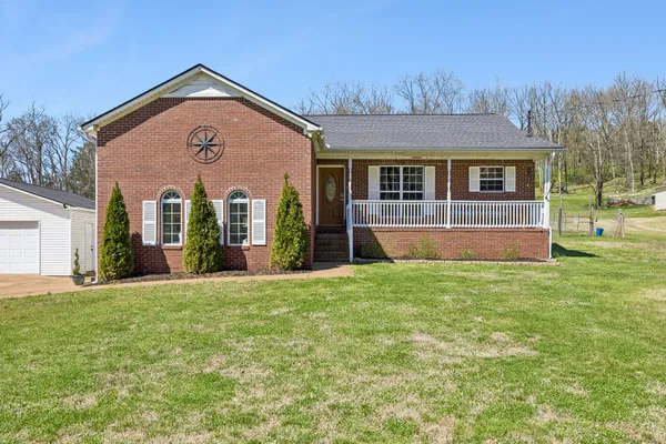 front view of a house with a yard