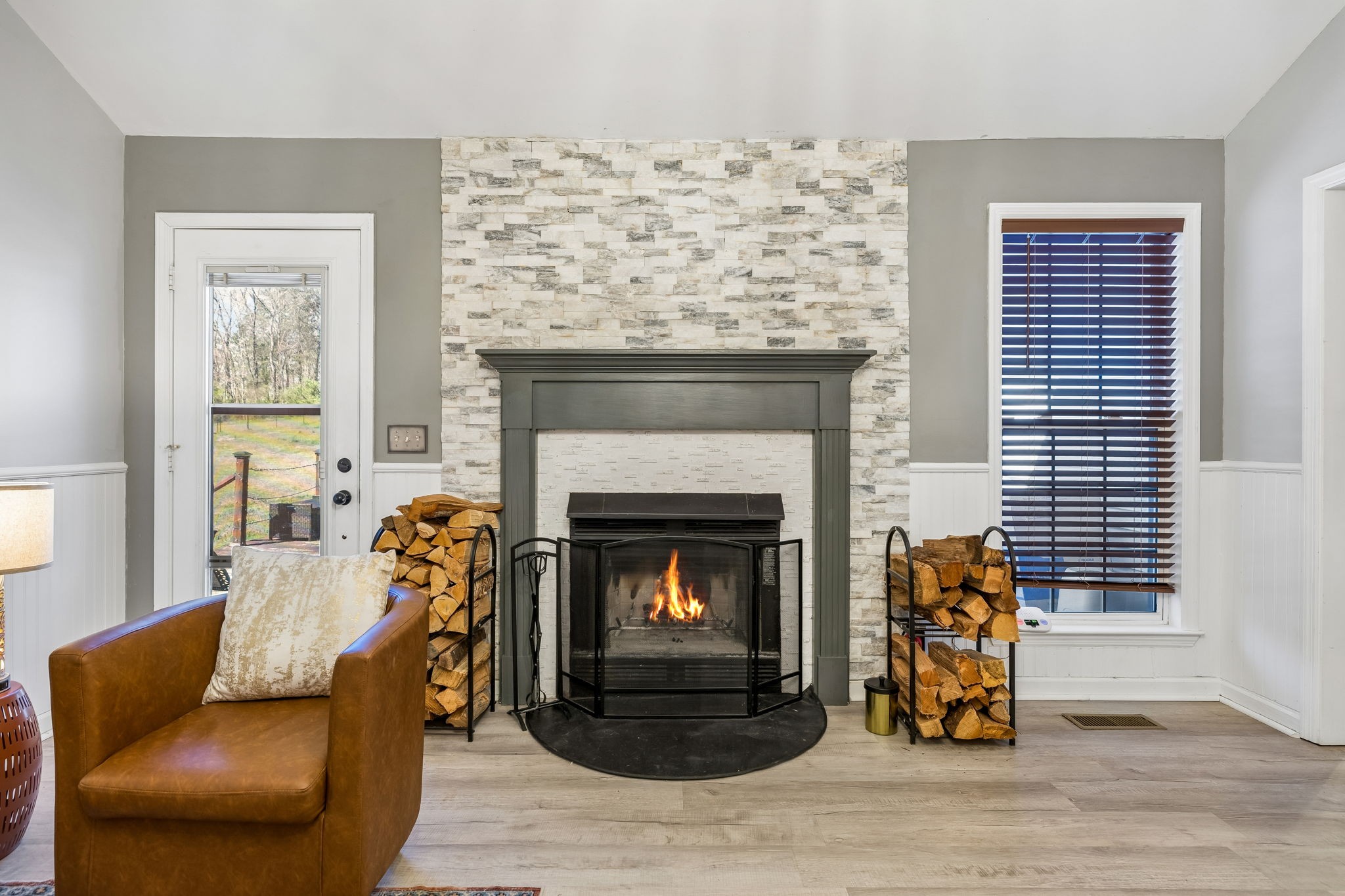 1245 Cliff Amos Road Spring Hill, TN 37174 - Photo 14 of 41 a living room with furniture and a fireplace
