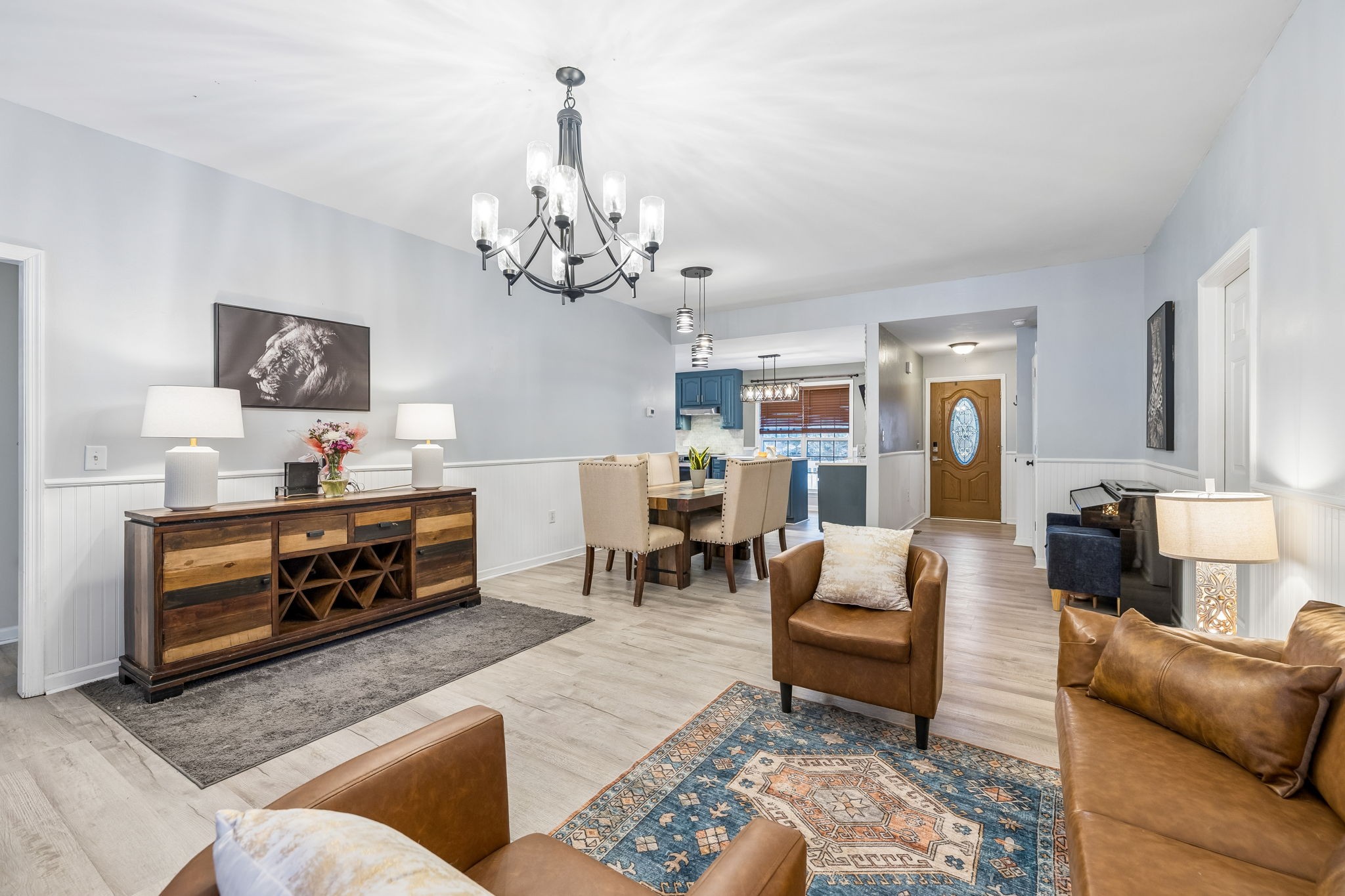 1245 Cliff Amos Road Spring Hill, TN 37174 - Photo 16 of 41 a living room with furniture and a chandelier