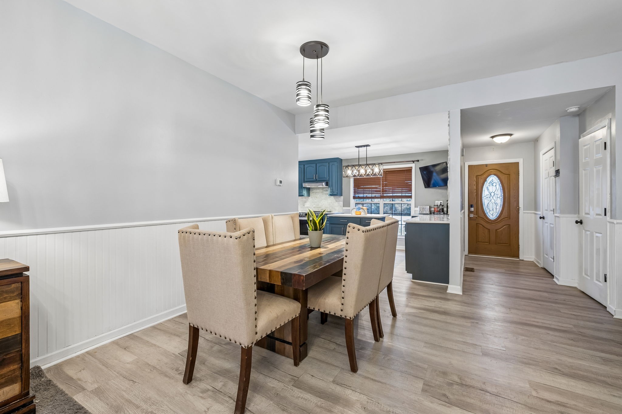 1245 Cliff Amos Road Spring Hill, TN 37174 - Photo 17 of 41 a view of a dining room with furniture and wooden floor