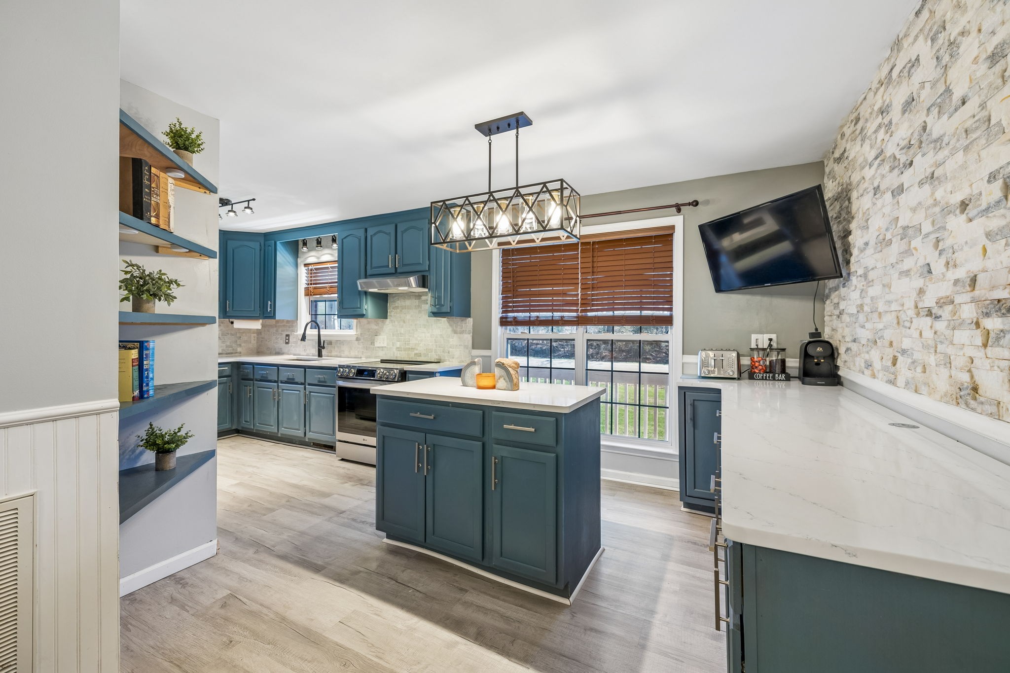 1245 Cliff Amos Road Spring Hill, TN 37174 - Photo 18 of 41 a kitchen with stainless steel appliances granite countertop a stove and a sink