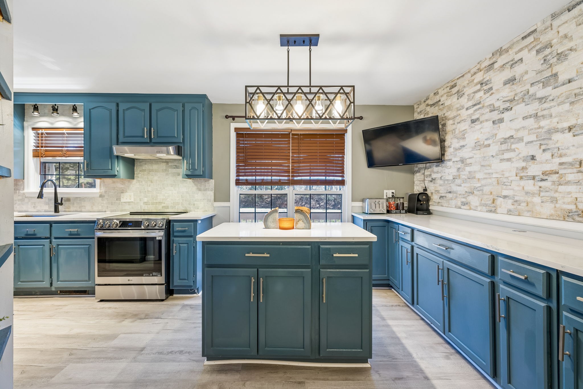 1245 Cliff Amos Road Spring Hill, TN 37174 - Photo 19 of 41 a kitchen with stainless steel appliances granite countertop a stove and a sink