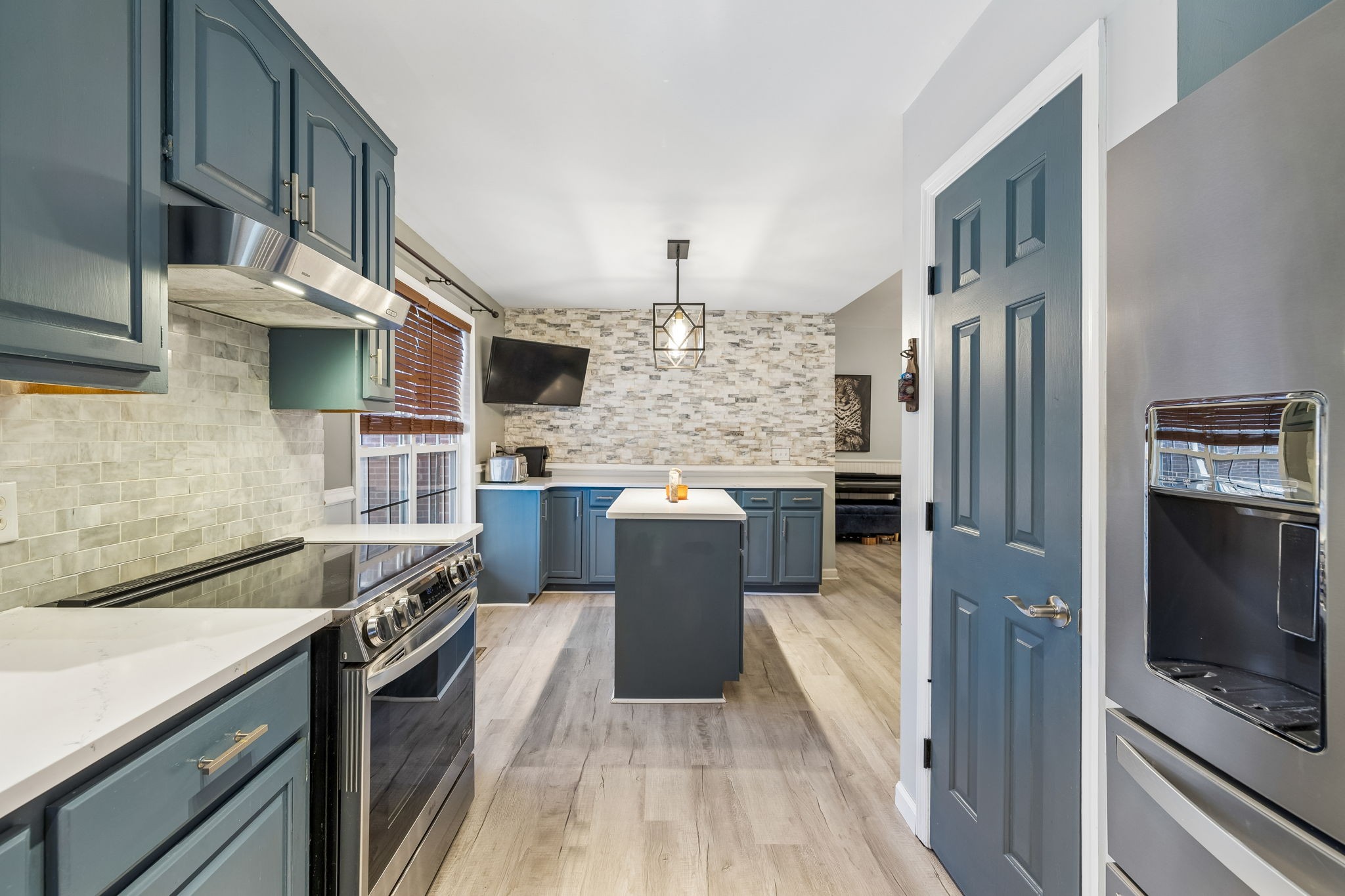1245 Cliff Amos Road Spring Hill, TN 37174 - Photo 24 of 41 a kitchen with stainless steel appliances granite countertop a refrigerator a stove a sink and a microwave