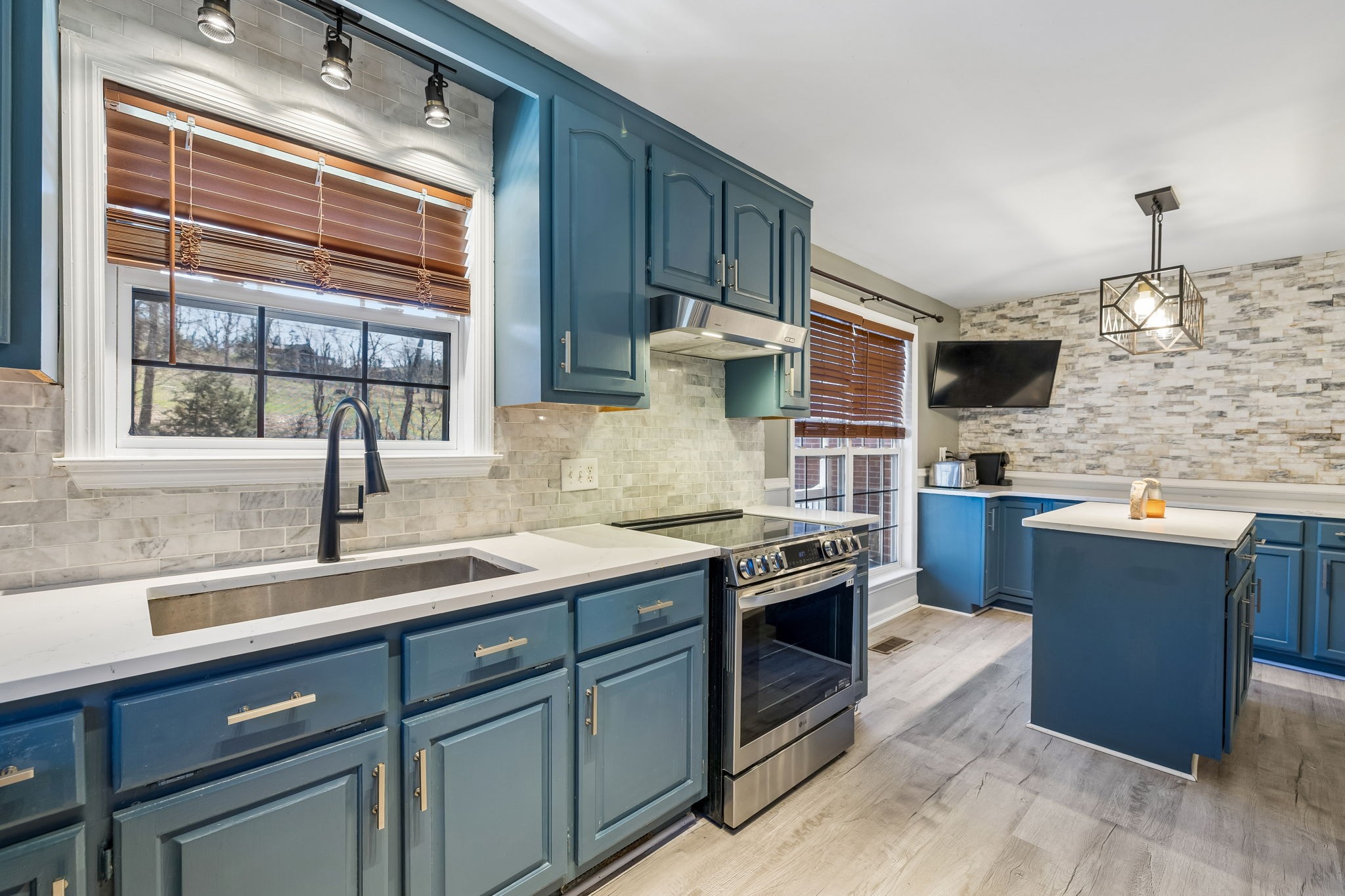 1245 Cliff Amos Road Spring Hill, TN 37174 - Photo 25 of 41 a kitchen with stainless steel appliances granite countertop a sink stove and oven