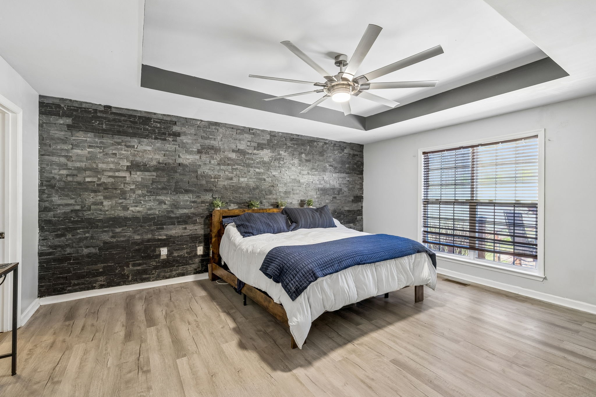 1245 Cliff Amos Road Spring Hill, TN 37174 - Photo 26 of 41 a spacious bedroom with a bed and a large window