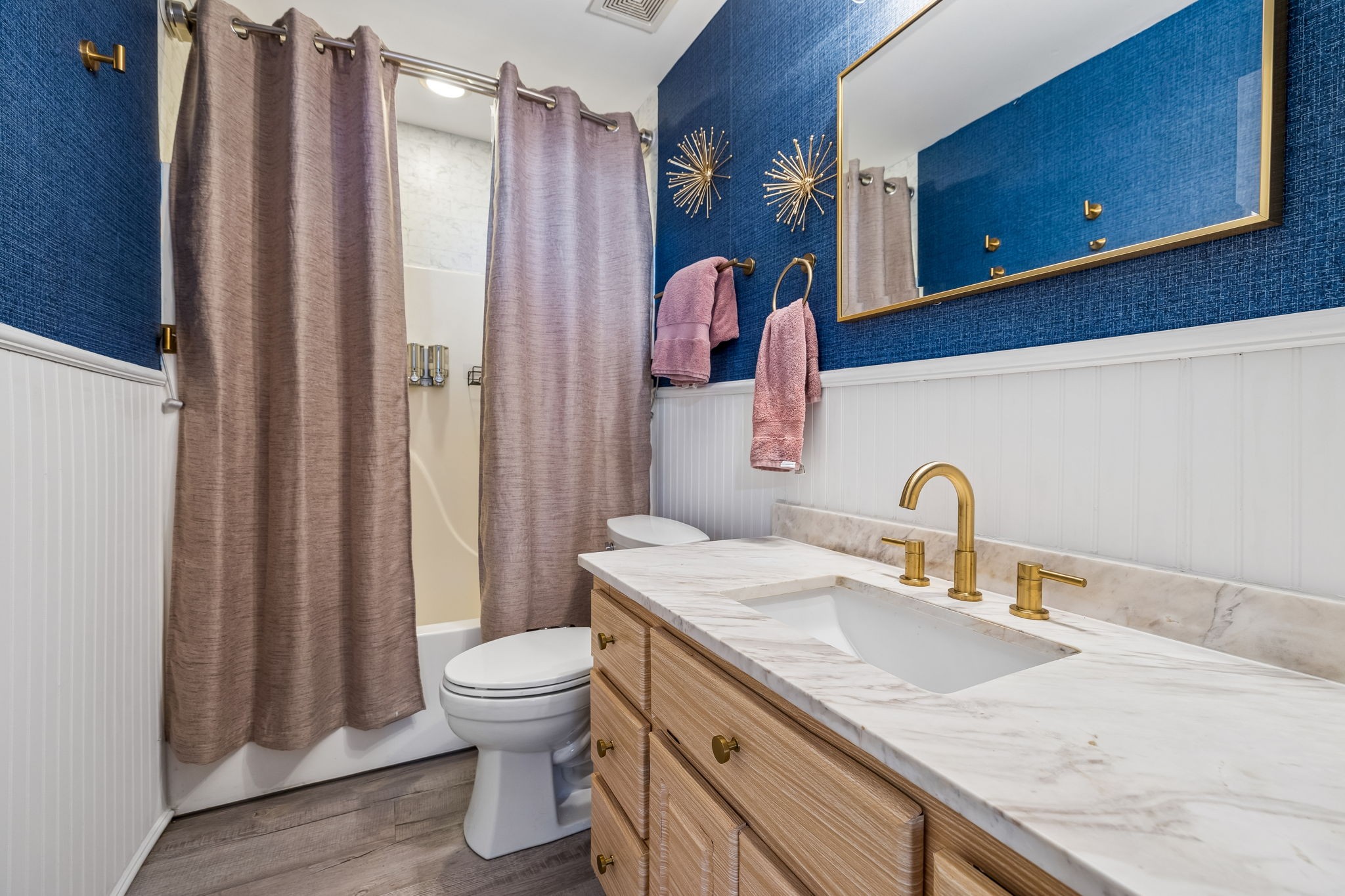 1245 Cliff Amos Road Spring Hill, TN 37174 - Photo 27 of 41 a bathroom with a granite countertop sink a toilet and a shower