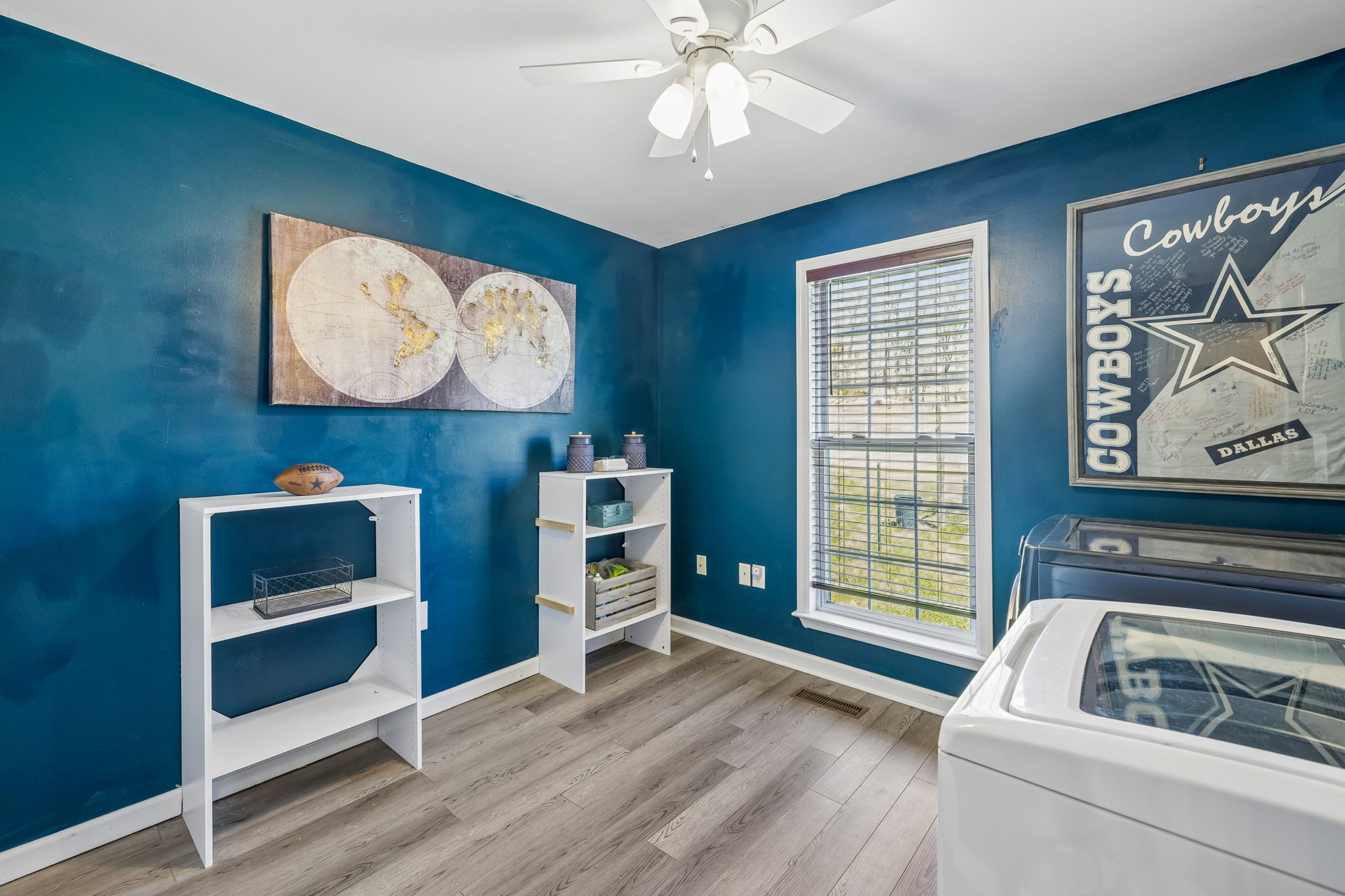 1245 Cliff Amos Road Spring Hill, TN 37174 - Photo 29 of 41 a living room with furniture and a flat screen tv