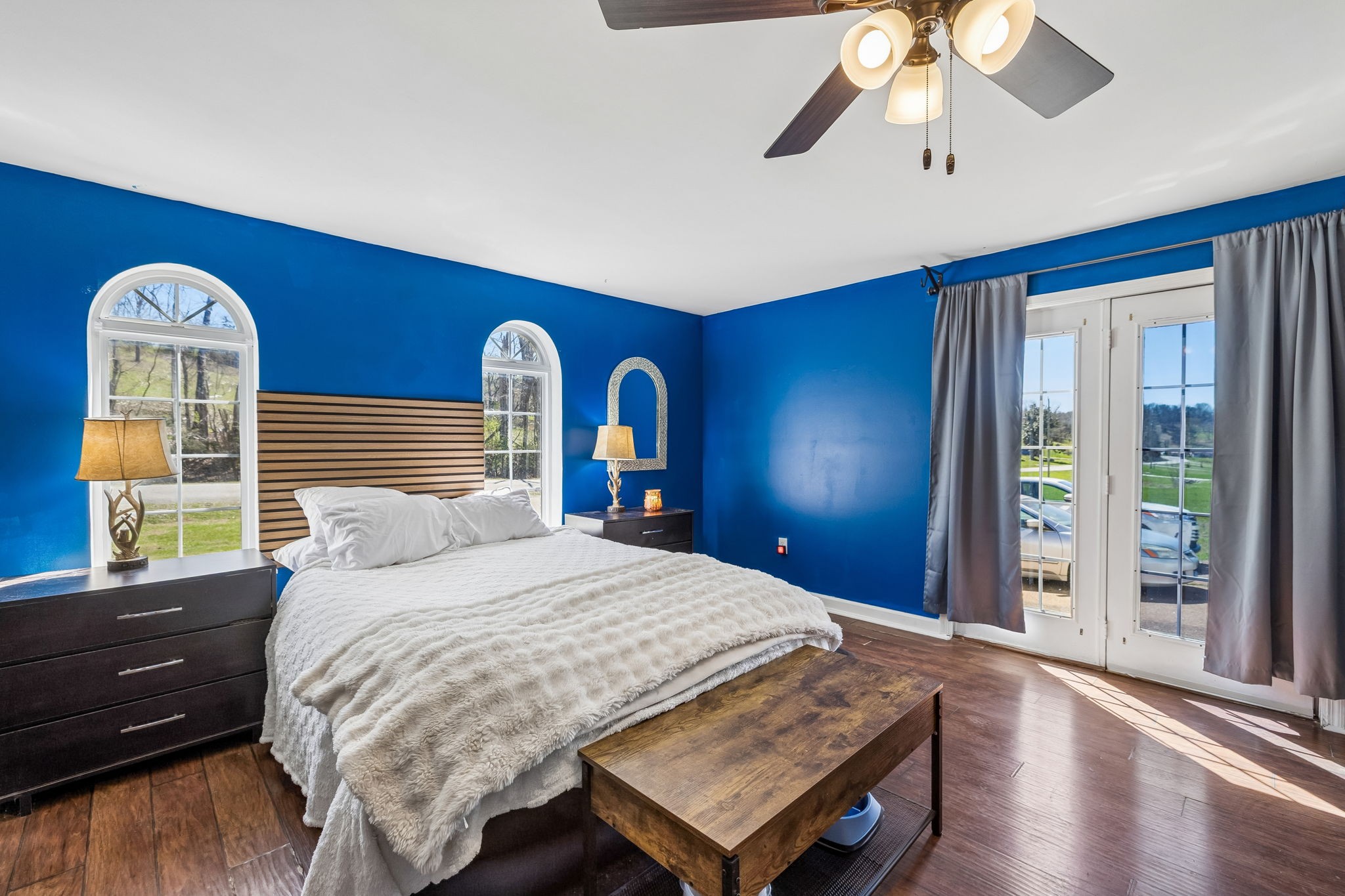 1245 Cliff Amos Road Spring Hill, TN 37174 - Photo 31 of 41 a bedroom with a bed and a chandelier