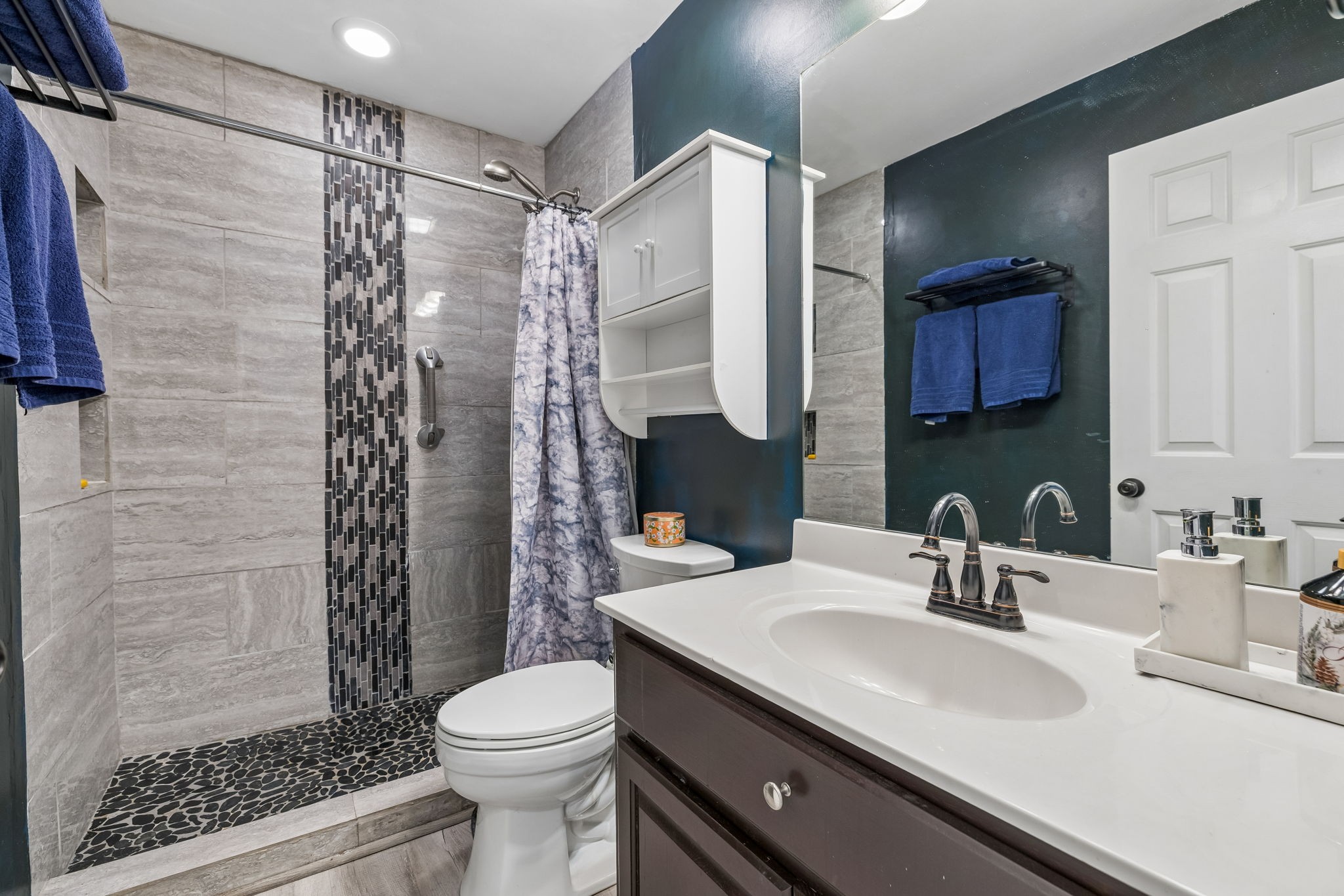 1245 Cliff Amos Road Spring Hill, TN 37174 - Photo 33 of 41 a bathroom with a sink toilet and shower