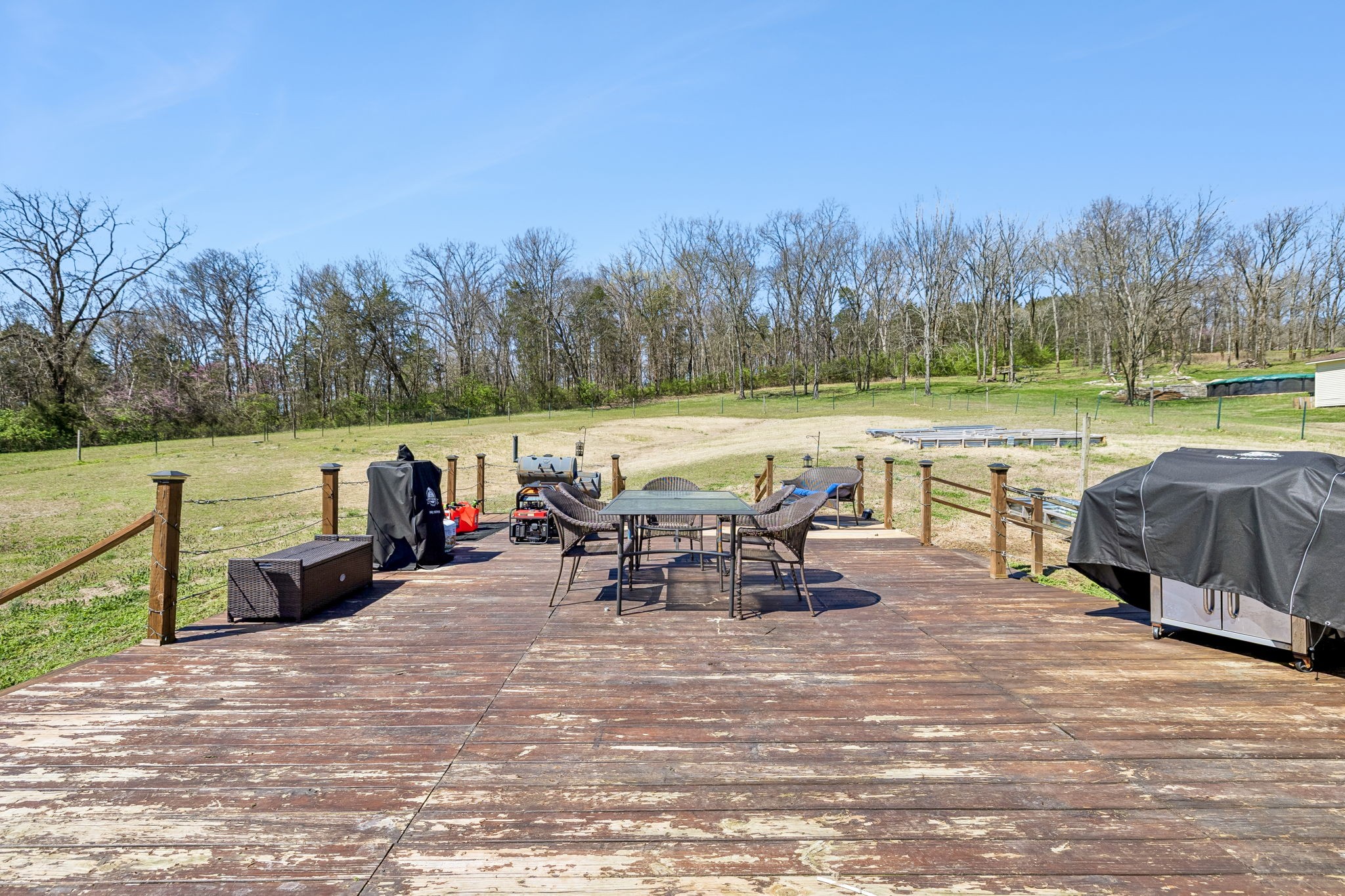 1245 Cliff Amos Road Spring Hill, TN 37174 - Photo 34 of 41 a view of a lake with outdoor seating and trees in the background