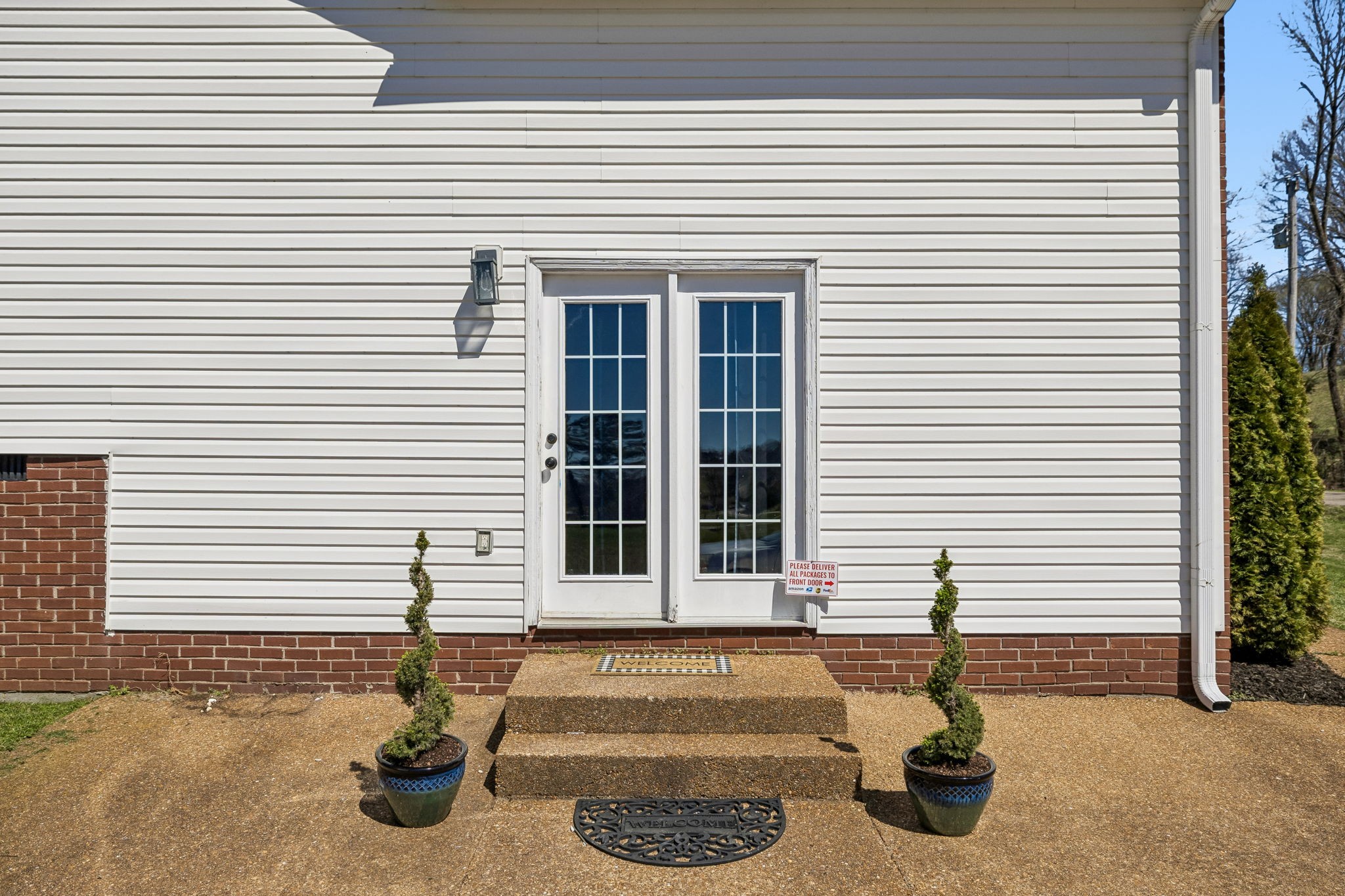 1245 Cliff Amos Road Spring Hill, TN 37174 - Photo 5 of 41 a front view of a house with a yard
