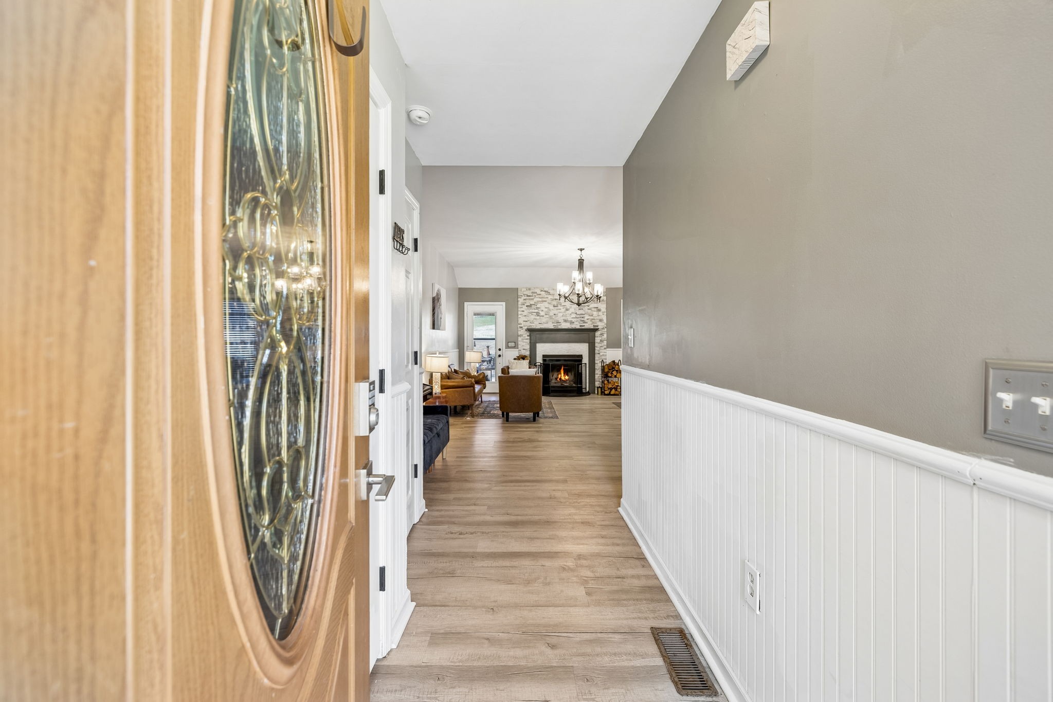1245 Cliff Amos Road Spring Hill, TN 37174 - Photo 7 of 41 a view of a hallway with wooden floor and staircase