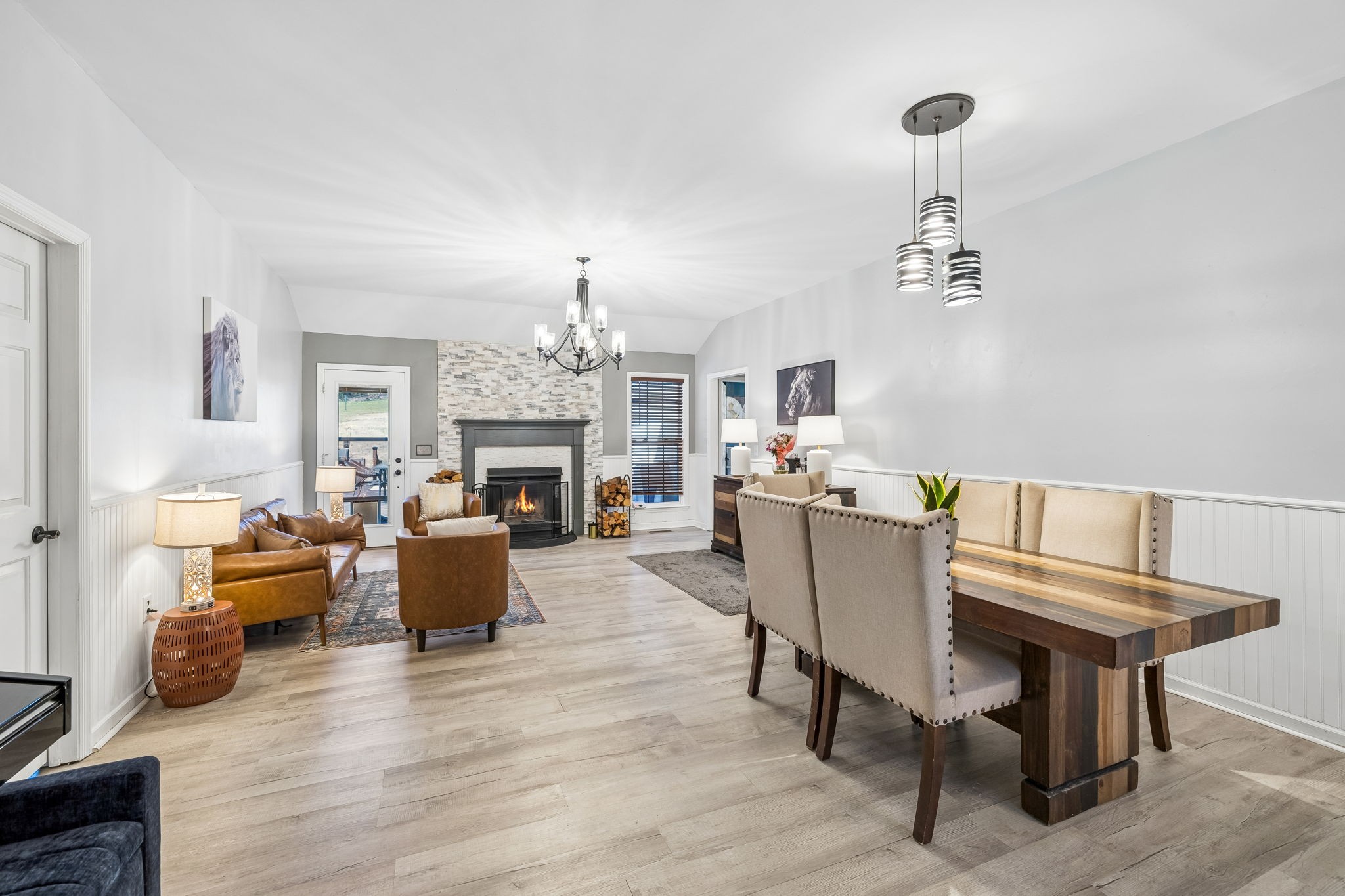 1245 Cliff Amos Road Spring Hill, TN 37174 - Photo 9 of 41 a living room with furniture and a chandelier