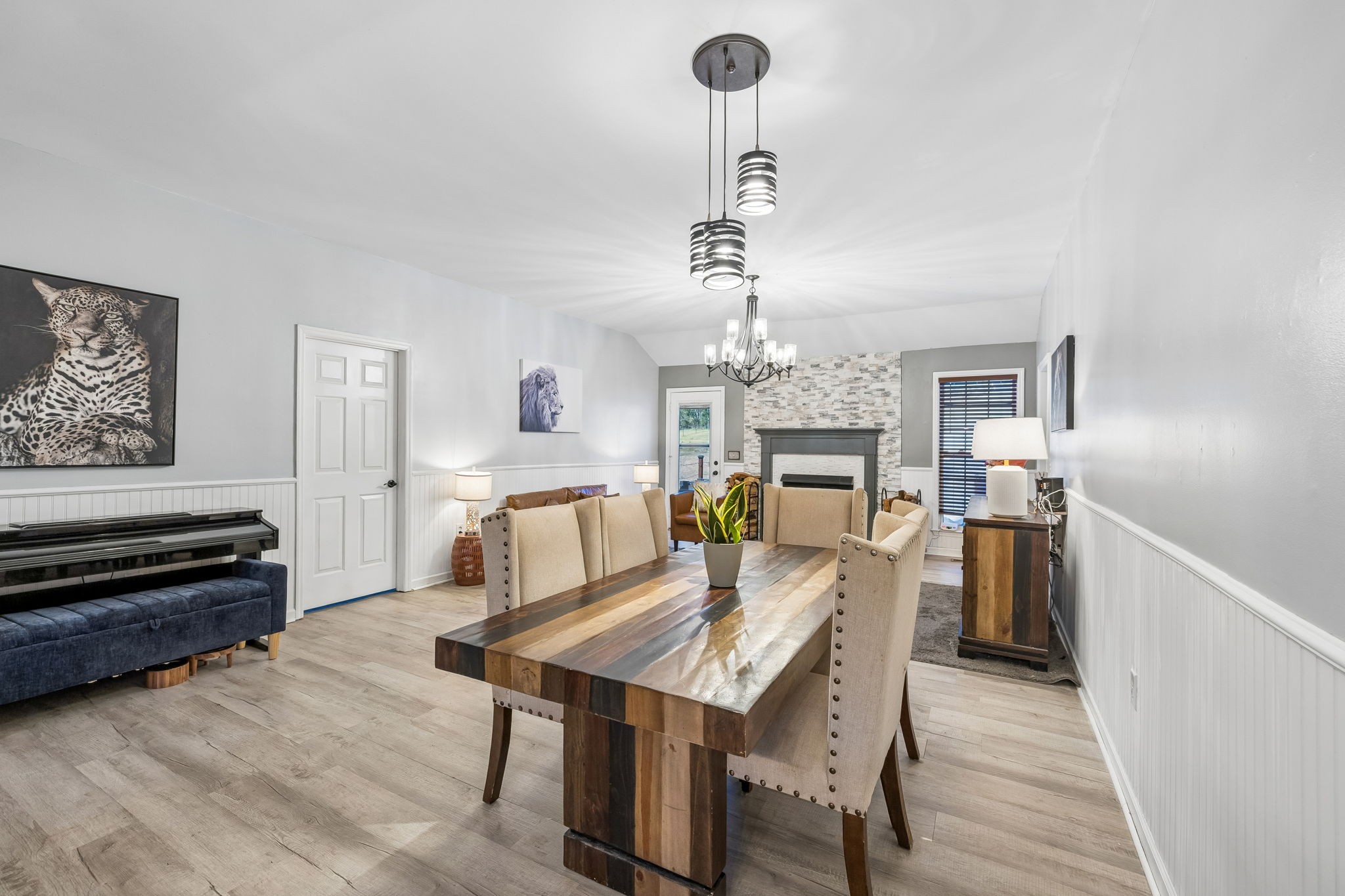1245 Cliff Amos Road Spring Hill, TN 37174 - Photo 10 of 41 a view of a dining room with furniture a chandelier and wooden floor