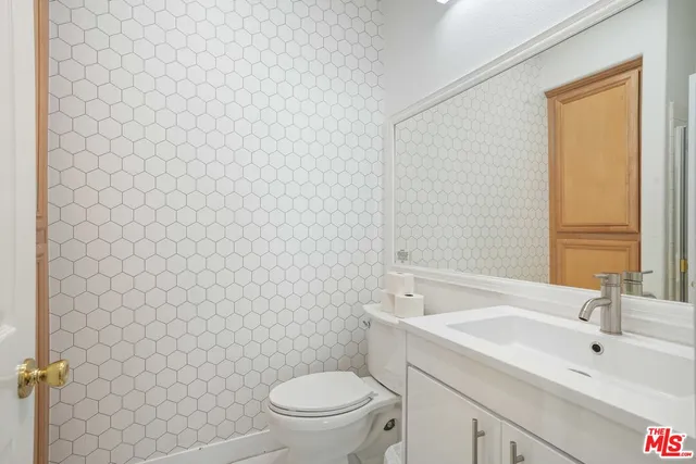 a kitchen with a sink stainless steel appliances and cabinets