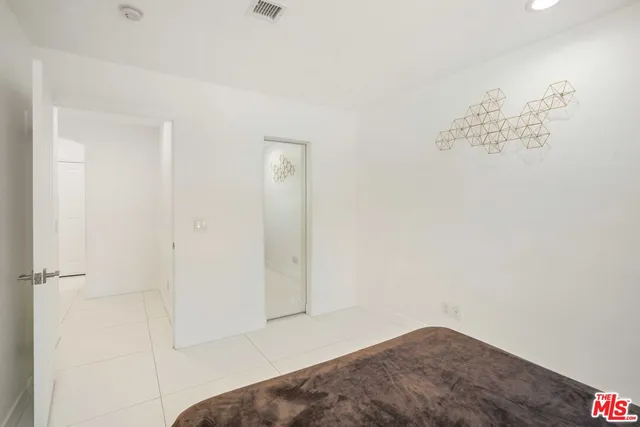 a kitchen with stainless steel appliances granite countertop a refrigerator sink and cabinets