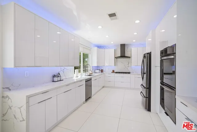 a view of a hallway with wooden floor and stairs