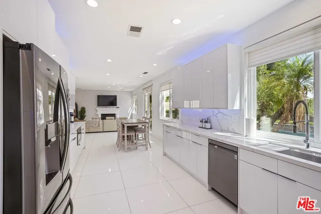 a bedroom with furniture fireplace and a window