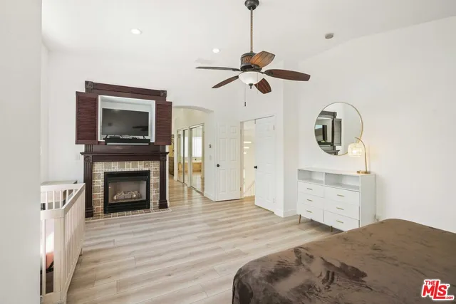 a spacious bathroom with a granite countertop sink mirror and a bathtub with shower