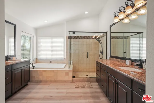 a bathroom with a sink and vanity