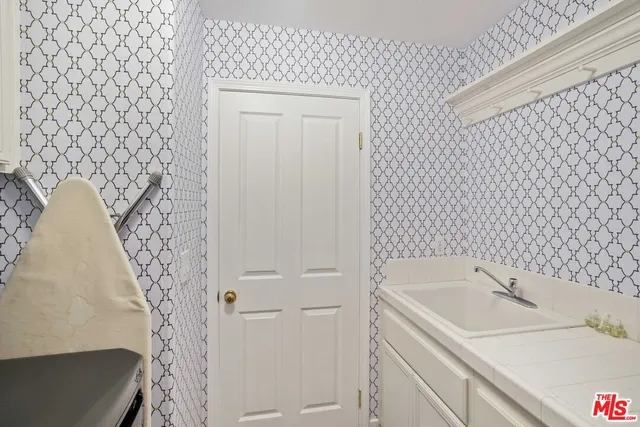 a view of a patio with a table chairs and a backyard
